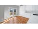 Bright eat-in kitchen featuring white cabinets and door to deck at 3200 Tackett Rd, Douglasville, GA 30135