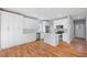 Spacious modern kitchen with white cabinets, stainless appliances and a large kitchen island at 3200 Tackett Rd, Douglasville, GA 30135