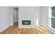 Living room features hardwood flooring and a modern fireplace with black trim at 3200 Tackett Rd, Douglasville, GA 30135