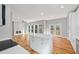 Open concept living room with a fireplace that flows into the kitchen and outdoor deck at 3200 Tackett Rd, Douglasville, GA 30135