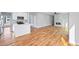Spacious living room with modern fireplace, hardwood floors, and large windows providing ample natural light at 3200 Tackett Rd, Douglasville, GA 30135