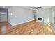 Bright living room features hardwood floors, modern fireplace, and ceiling fan at 3200 Tackett Rd, Douglasville, GA 30135