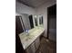 Bathroom featuring a large mirror over a sink at 4707 Mariners Way, Stone Mountain, GA 30083