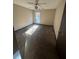 A bright bedroom featuring a ceiling fan, window with natural light, and neutral paint color at 4707 Mariners Way, Stone Mountain, GA 30083