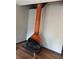 Unique orange fireplace feature with an overhead flue, adding a retro style to the home's interior at 4707 Mariners Way, Stone Mountain, GA 30083