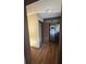 Hallway with wood-look flooring and an open doorway at 4707 Mariners Way, Stone Mountain, GA 30083