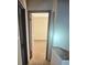 Hallway with open bedroom featuring carpet at 4707 Mariners Way, Stone Mountain, GA 30083