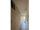 Hallway leading into the kitchen featuring wood flooring and natural light, providing a view into the space at 4707 Mariners Way, Stone Mountain, GA 30083