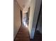 Hallway with hardwood floors and open doorway leading to living area at 4707 Mariners Way, Stone Mountain, GA 30083