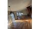 Open-concept living room featuring hardwood floors, natural light, and a retro fireplace, showing the home's interior at 4707 Mariners Way, Stone Mountain, GA 30083
