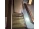 Stairway leading to the upper floor with neutral carpet at 4707 Mariners Way, Stone Mountain, GA 30083