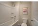 Cozy bathroom with a white bathtub, toilet, and a shower featuring clean and neutral design at 1856 Kingsmere Run Dr, Loganville, GA 30052