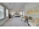 Spacious bedroom with neutral decor, large windows, and sitting area at 1856 Kingsmere Run Dr, Loganville, GA 30052
