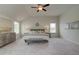 Bright and airy bedroom with large windows, a ceiling fan, and comfortable seating at 1856 Kingsmere Run Dr, Loganville, GA 30052