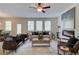 Spacious living room featuring a fireplace, comfortable seating, and modern decor at 1856 Kingsmere Run Dr, Loganville, GA 30052