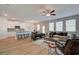 Open-concept living area with a kitchen, dining space, and comfortable seating arrangement at 1856 Kingsmere Run Dr, Loganville, GA 30052