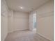 Spacious walk-in closet with carpeted floor and wire shelves at 1856 Kingsmere Run Dr, Loganville, GA 30052