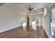 Bright and spacious bedroom featuring hardwood floors, tray ceilings, and large windows at 1921 Harvest Way, Loganville, GA 30052