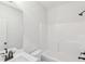 Bright bathroom featuring a vanity with modern fixtures and a clean bathtub and shower combo at 3278 Greenhill Dr, Villa Rica, GA 30180