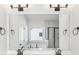 Bright bathroom with a large mirror, dual sinks, and a view of the bathtub and shower at 3278 Greenhill Dr, Villa Rica, GA 30180