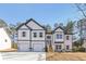 New construction two-story home featuring a two-car garage and professionally landscaped front yard at 3278 Greenhill Dr, Villa Rica, GA 30180