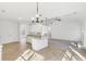 Well-lit open-concept kitchen with modern white cabinets, granite countertops, and stainless steel appliances at 3278 Greenhill Dr, Villa Rica, GA 30180