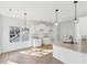 Bright kitchen featuring white cabinets, granite countertops, stainless steel sink, and hardwood floors at 3278 Greenhill Dr, Villa Rica, GA 30180