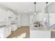 Bright kitchen with white cabinets, granite countertops, and stainless steel faucet at 3278 Greenhill Dr, Villa Rica, GA 30180