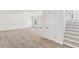 Expansive living room featuring plush carpeting and a staircase nearby at 3278 Greenhill Dr, Villa Rica, GA 30180