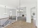 Bright living room with hardwood floors, a cozy fireplace, and stylish light fixtures at 3278 Greenhill Dr, Villa Rica, GA 30180