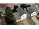 Aerial view of the house showing the roof, driveway, and proximity to neighboring homes at 5114 Arnold St, Covington, GA 30014