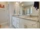 Bathroom features a double sink vanity with granite countertops and a glass-enclosed shower at 5114 Arnold St, Covington, GA 30014