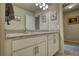 Beautiful bathroom features granite countertops, white cabinetry, brushed nickel hardware, and a well lit vanity mirror at 5114 Arnold St, Covington, GA 30014