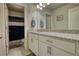 Bright bathroom features granite countertops, white cabinetry, brushed nickel hardware, and a shower-tub combo at 5114 Arnold St, Covington, GA 30014