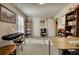 Spacious bonus room with bookshelves, closet, and ample natural light perfect for playroom, music room or home office at 5114 Arnold St, Covington, GA 30014