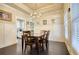 Elegant dining room featuring dark hardwood floors and wainscoting at 5114 Arnold St, Covington, GA 30014