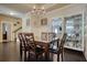 Formal dining room with a chandelier, hardwood floors, and stylish furnishings at 5114 Arnold St, Covington, GA 30014