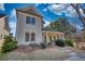 Beautiful two-story home with a charming front porch and lush front yard landscaping at 5114 Arnold St, Covington, GA 30014