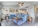 Spacious open-concept living room flows into the kitchen with blue sofas and hardwood floors at 5114 Arnold St, Covington, GA 30014