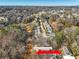Aerial view shows the river's location in relation to the townhome and nearby wooded area at 164 Oxbo Rd, Roswell, GA 30075