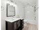 Stylish bathroom featuring a modern vanity, sleek mirror, and a clean bathtub with shower at 164 Oxbo Rd, Roswell, GA 30075