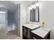 Upper level bathroom featuring a modern vanity, great lighting, and hallway access at 164 Oxbo Rd, Roswell, GA 30075
