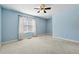 Large bedroom with large window and neutral carpet at 164 Oxbo Rd, Roswell, GA 30075