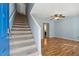 Bright entryway with hardwood floors, staircase, and a view into the spacious living area at 164 Oxbo Rd, Roswell, GA 30075
