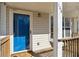 Charming front porch with a blue screen door, house numbers, and a cozy welcome mat at 164 Oxbo Rd, Roswell, GA 30075