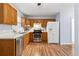 Well-lit kitchen with stainless steel appliances, wooden cabinetry, and bright countertops at 164 Oxbo Rd, Roswell, GA 30075