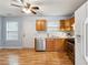 Well-lit kitchen with stainless steel appliances, wood cabinets, and hardwood floors at 164 Oxbo Rd, Roswell, GA 30075