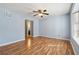 Spacious living room featuring hardwood floors, a ceiling fan, and easy access to the kitchen at 164 Oxbo Rd, Roswell, GA 30075