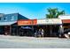 Charming street with a variety of shops and outdoor seating under a bright blue sky at 164 Oxbo Rd, Roswell, GA 30075