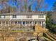 Charming townhomes with inviting front porches and colorful shutters nestled amongst mature trees at 164 Oxbo Rd, Roswell, GA 30075